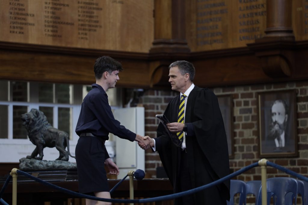 Form 6 student Sam Fisher receives Colours for Rowing